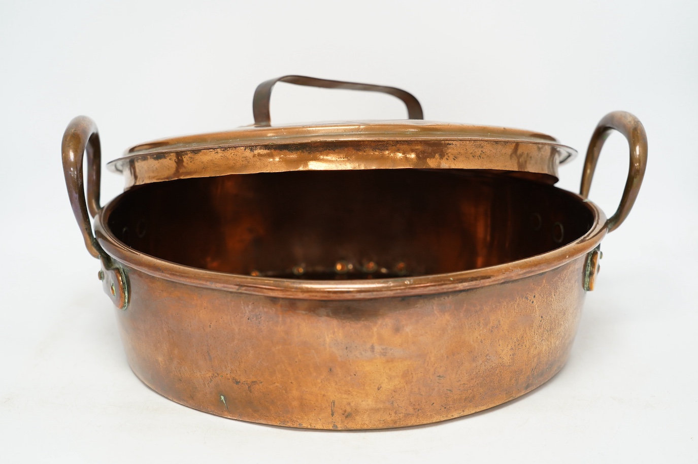 Two copper pans, one handled and the other with cover, 38cm diameter. Condition - fair